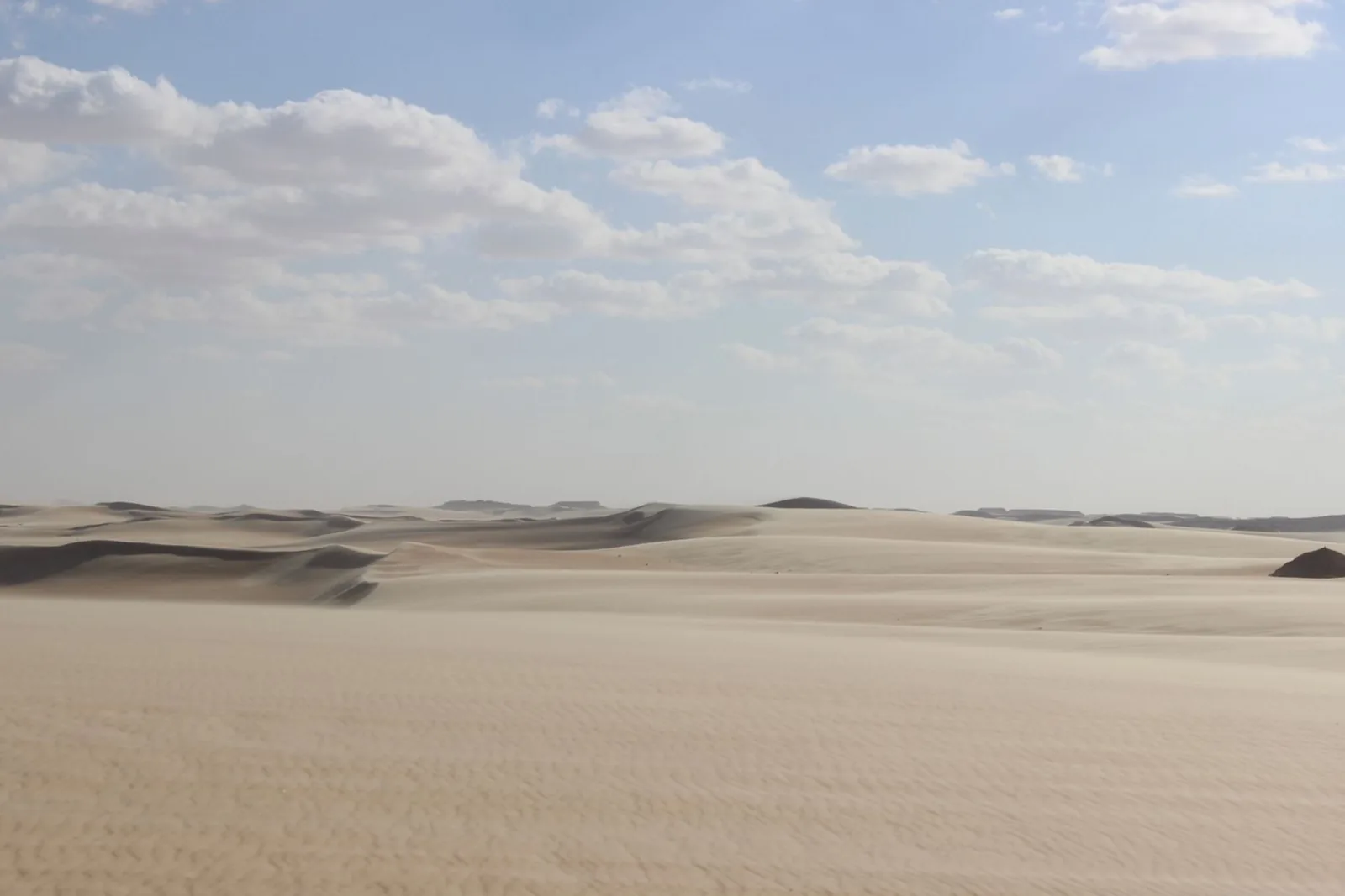 Layered desert ridges under an open sky