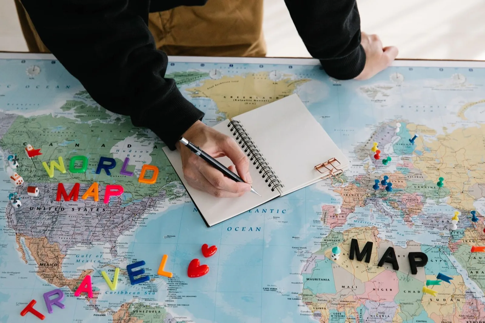 A folded paper map and simple travel notes