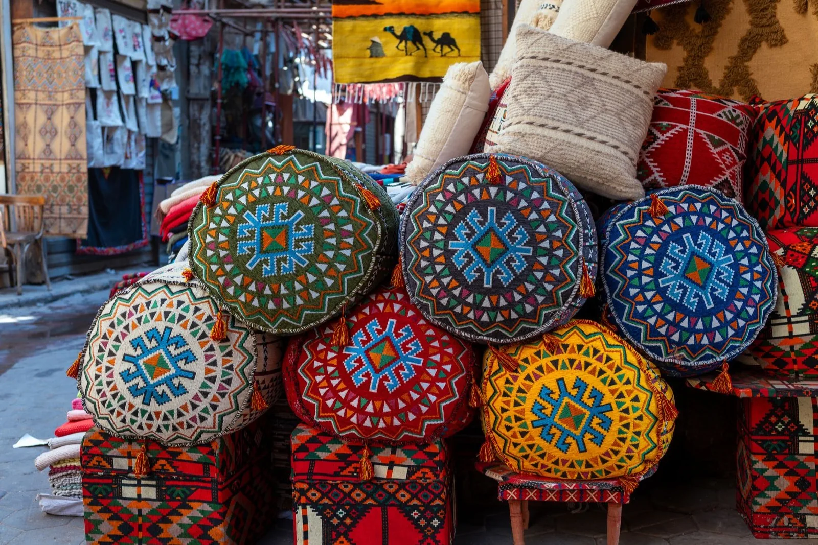 Colorful woven textiles arranged at a local market