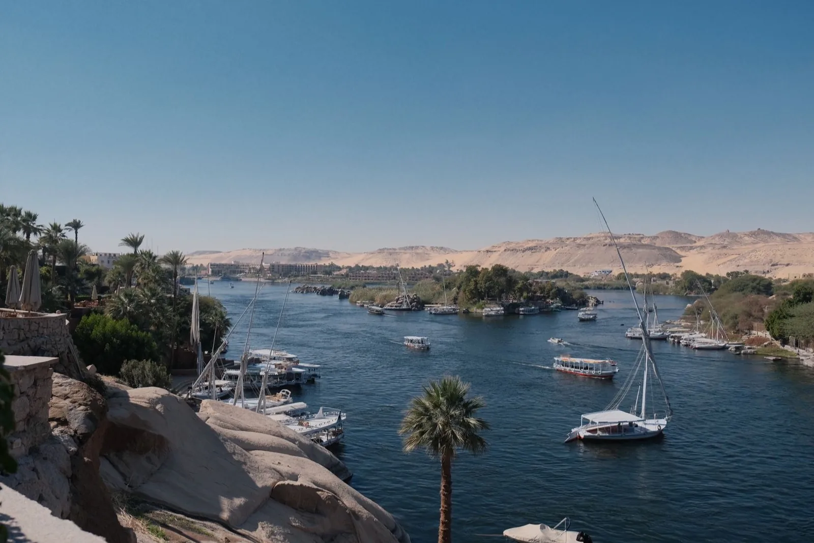 A broad view along the Nile with city buildings at the water's edge